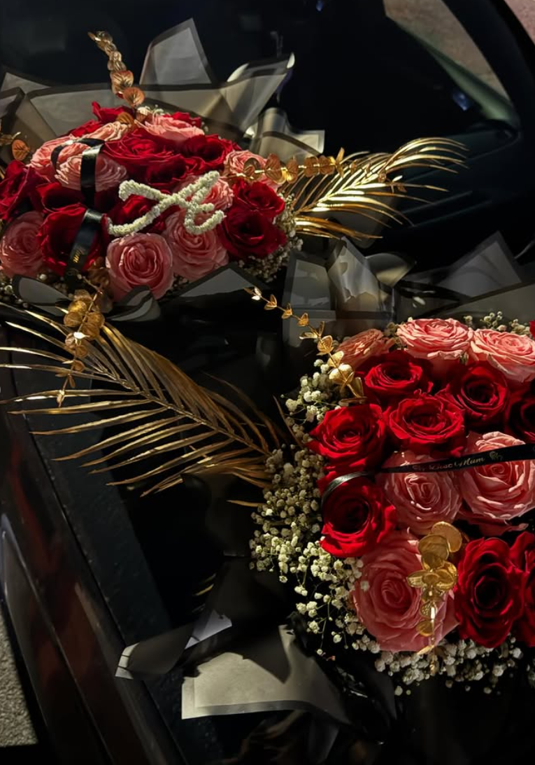 Two red and pink rose bouquets with gold foliage