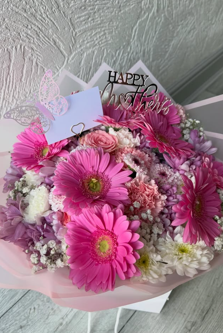 Pink gerbera and rose Mother's Day bouquet in blush wrap