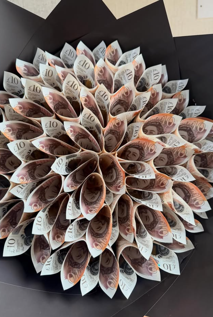 £10 note money bouquet folded into petals on black wrap